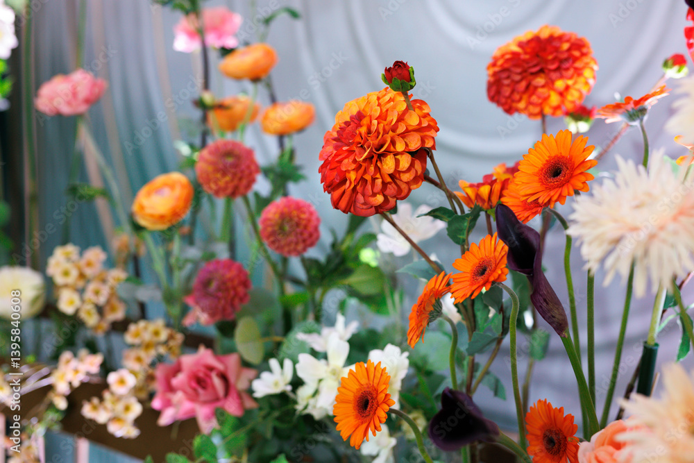 Fototapeta premium Wedding decoration with beautiful bright colors. Lots of colorful flowers and greenery in close-up.