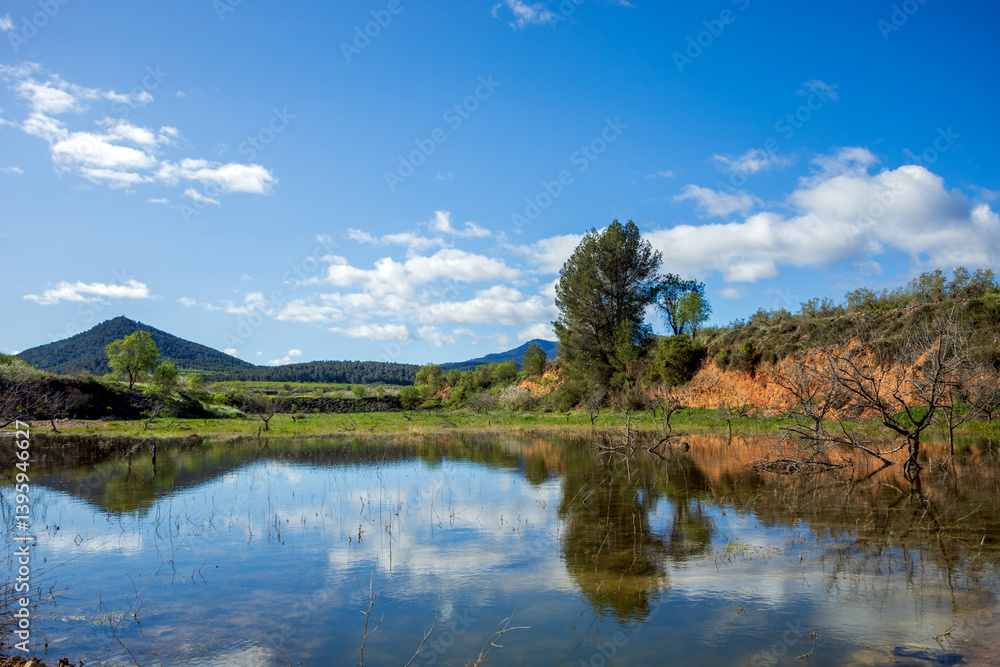 Landscape near the Burete mountain range in Bullas, Murcia Region, Spain, with water in one of its ravines after the rains Landscape near the Burete mountain range in Bullas, Murcia Region, Spain, with water in one of its ravines after the rains