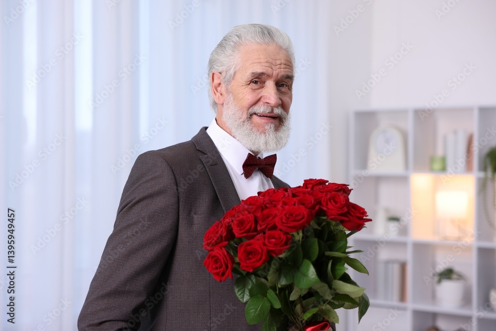Senior man with bouquet of red roses at home Senior man with bouquet of red roses at home