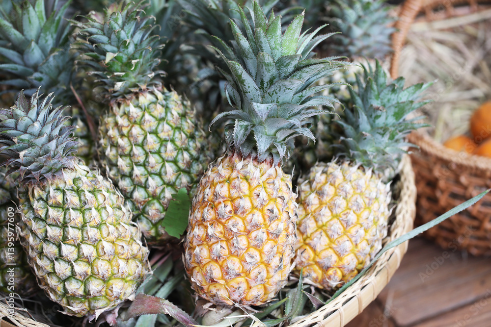 Fototapeta premium Pineapple or Ananus fruit in traditional Asian basket