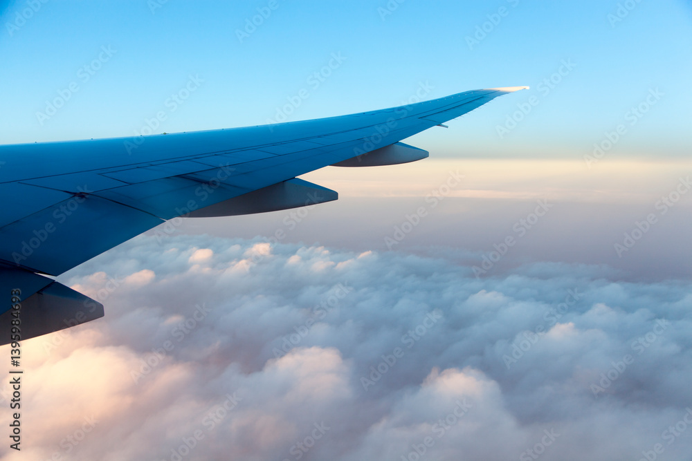 Flying Over Clouds In Asia At Dawn