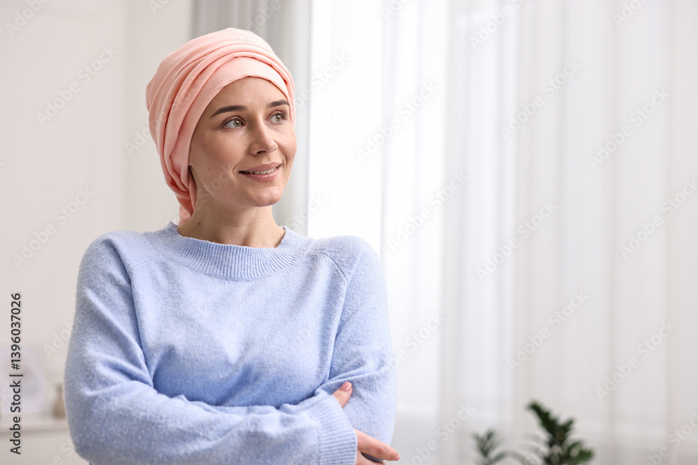 Portrait of smiling woman with cancer in headscarf indoors. Space for text Portrait of smiling woman with cancer in headscarf indoors. Space for text