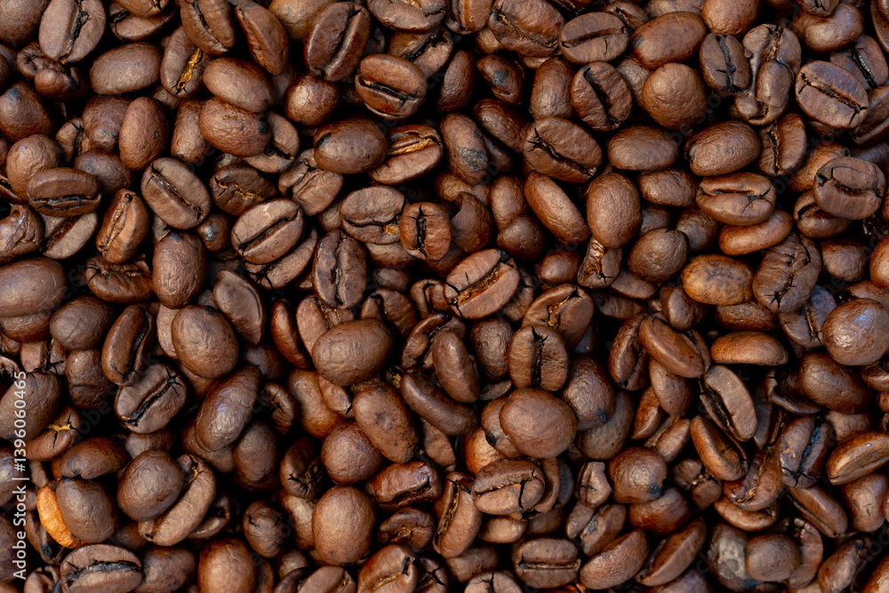 Close-up of roasted coffee beans with rich brown tones and textured surfaces, perfect for backgrounds, food and drink concepts, or coffee-themed designs. Close-up of roasted coffee beans with rich brown tones and textured surfaces, perfect for backgrounds, food and drink concepts, or coffee-themed designs.