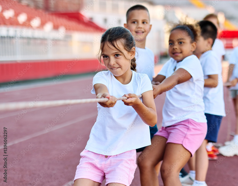 child sport exercise athlete rope competition strength challenge teamwork effort pulling pull tug rivalry struggle war conflict power contest team fun