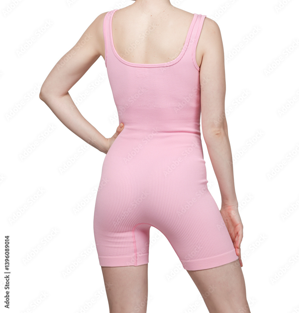 Close-up of a woman's lower torso wearing grey ribbed high-waisted shorts. White background. Fitness, activewear, sportswear concept.