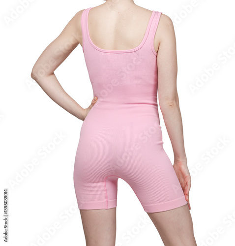 Obraz na płótnie Close-up of a woman's lower torso wearing grey ribbed high-waisted shorts. White background. Fitness, activewear, sportswear concept. w salonie