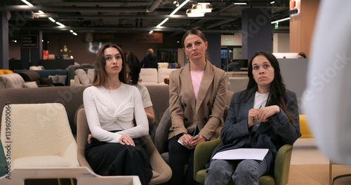 Job applicant gesturing while communicating with recruiters during interview, highlighting professional nonverbal interaction in modern corporate environment. concept of woman is collection