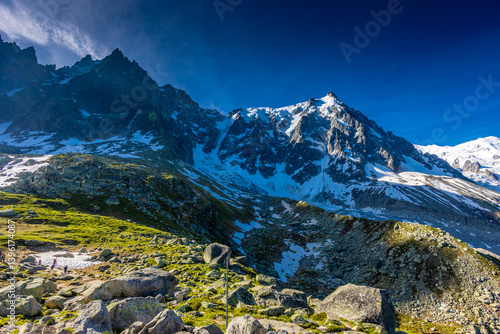 Aiguille du Midi peak in the Alps. Chamonix valley landscape of a prominent rocky towering mountain peak in French Alps. Chamonix-Montblanc area beautiful landscape of Aiguille du Midi summit, France
