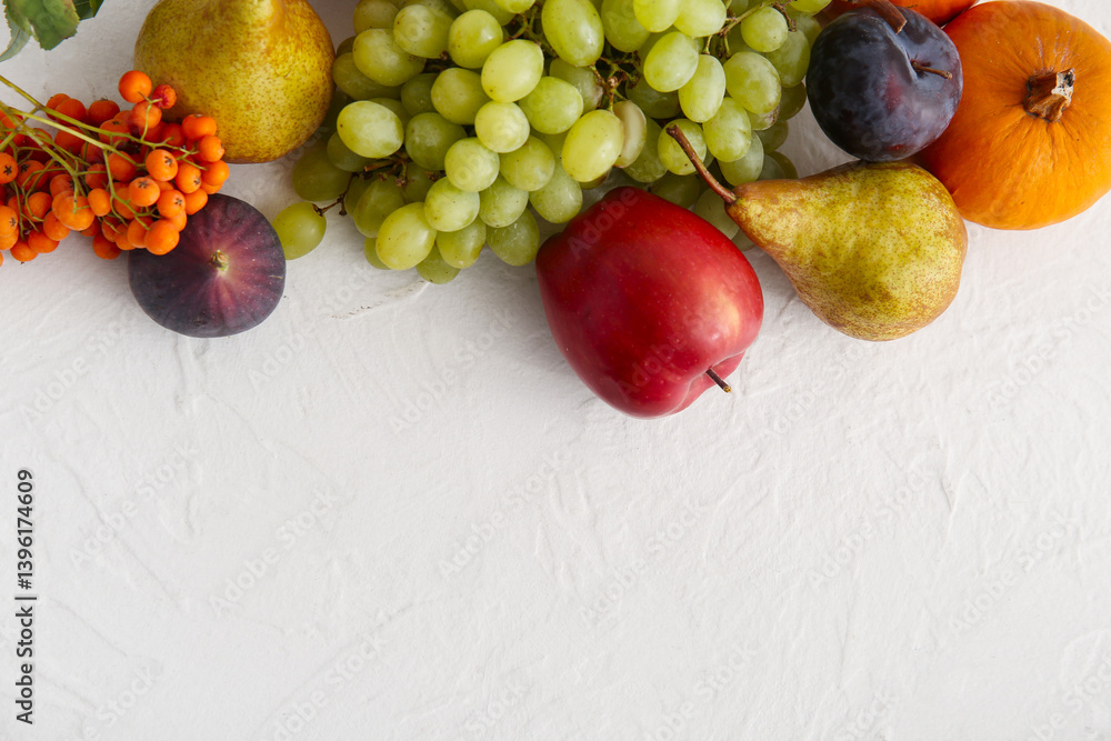 Different fresh fruits and pumpkin on white background