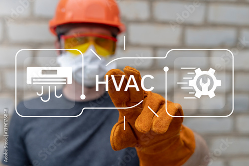 Obraz na płótnie Engineer using virtual touch screen presses text: HVAC. Concept of HVAC or Heating Ventilation Air Conditioning. HVAC engineering. w salonie