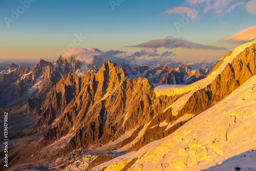 Aiguille du Midi peak in the Alps. Chamonix valley landscape of a prominent rocky towering mountain peak in French Alps. Chamonix-Montblanc area beautiful landscape of Aiguille du Midi summit, France