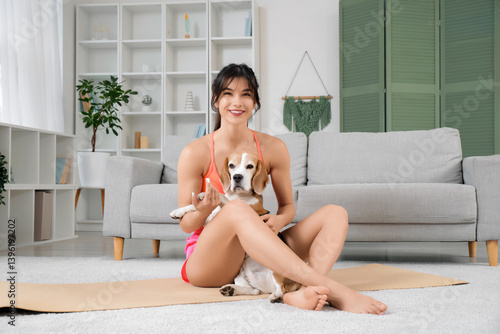 Young sporty woman pet her ...