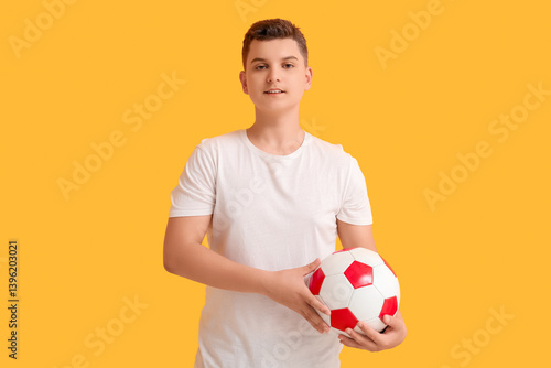 Teenage boy holding soccer ...