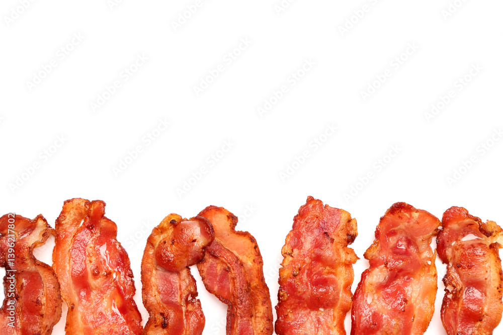 Many fried bacon rashers on white background