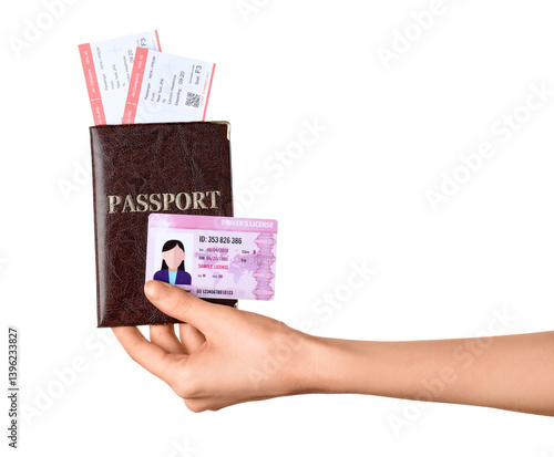 Female hand with passport, tickets and driving license on white background, closeup