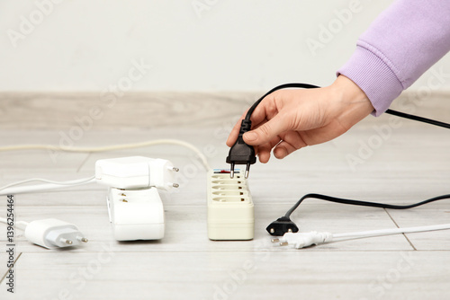 Female hand getting out plu...
