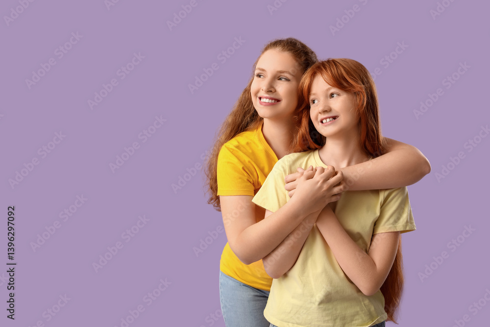 Beautiful young woman hugging her cute daughter on lilac background. Mother's Day celebration Beautiful young woman hugging her cute daughter on lilac background. Mother's Day celebration