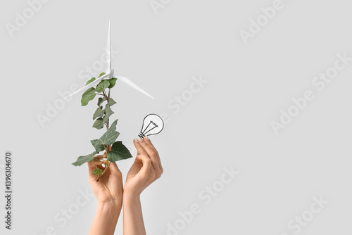Female hands with wind turb...