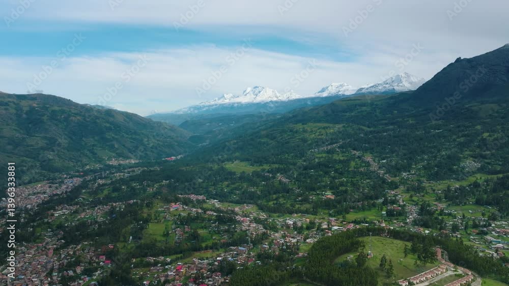 Aerial drone view of Huaraz, Peru, with a stunning horizon and the Cordillera Blanca mountains in the background. Aerial drone view of Huaraz, Peru, with a stunning horizon and the Cordillera Blanca mountains in the background.