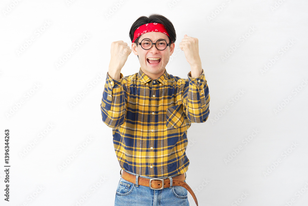 Fototapeta premium アキバ系の男性 ガッツポーズ 白背景 両手