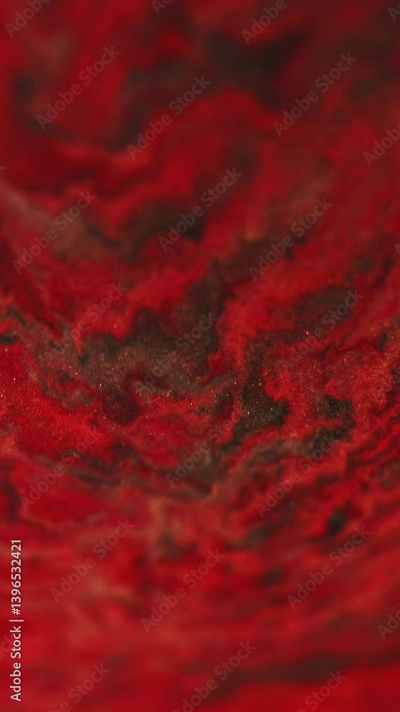 Vertical video. Shimmer marble. Acryl wave. Magic fluid drip. Defocused red black brown gold wet paint flow color shiny serum abstract art background. Vertical video. Shimmer marble. Acryl wave. Magic fluid drip. Defocused red black brown gold wet paint flow color shiny serum abstract art background.