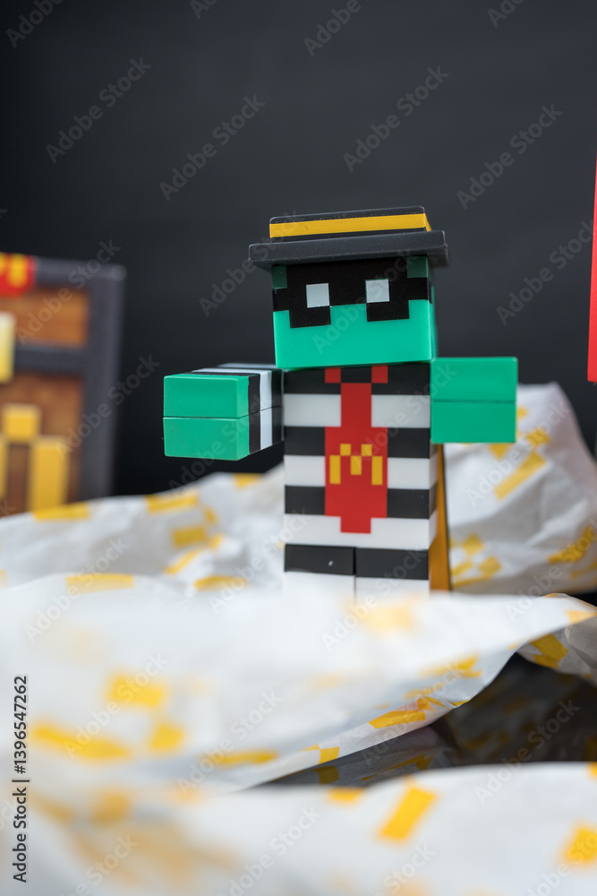 Naklejka premium Bangkok, Thailand - April 10, 2025 : Toy of Zombie hamburglar form McDonald. Blind box toy from McDonald's collaboration with Minecraft movie.