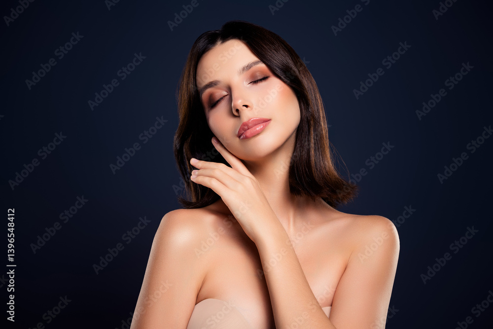 Gentle portrait of a young woman with natural beauty highlighting skincare and self-care concepts on a dark background Gentle portrait of a young woman with natural beauty highlighting skincare and self-care concepts on a dark background