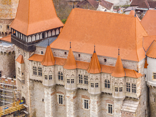 Obraz na płótnie Aerial close up view of Corvin castle in Hunedoara Romania restored Gothic palace with red rood w salonie