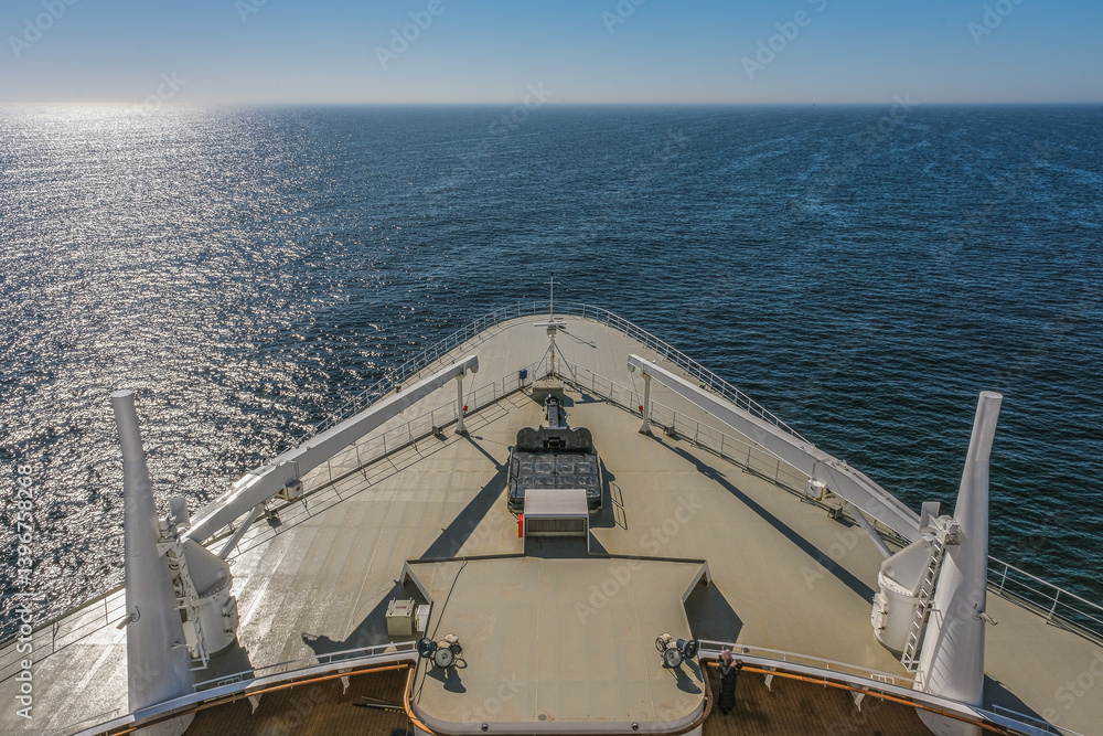 Views onto outdoor teak balcony terrace veranda promenade observation deck of ocean liner cruiseship cruise ship with at sea during Transatlantic Crossing to New York on beautiful sun day