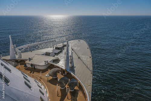 Views onto outdoor teak balcony terrace veranda promenade observation deck of ocean liner cruiseship cruise ship with at sea during Transatlantic Crossing to New York on beautiful sun day
