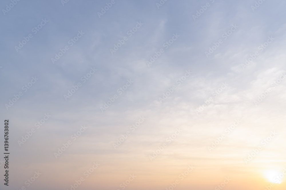 Fototapeta premium Full frame of beautiful morning or evening blue and orange sky with cloudy while sunsets or sunrises taken at the sea used as natural blackground texture