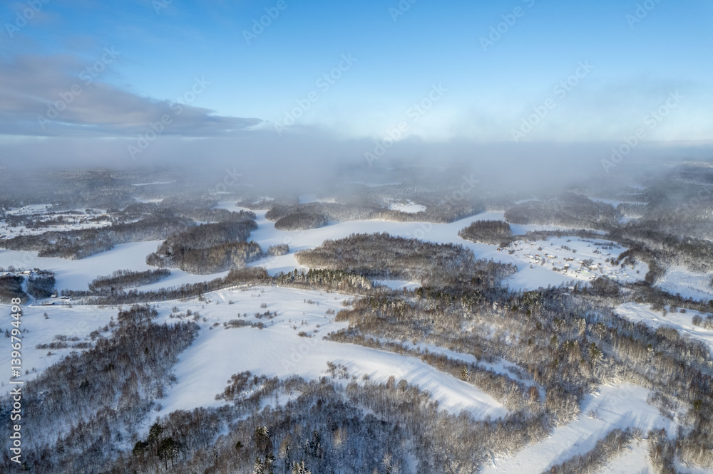 Obraz premium Lakes in the forest is covered with ice in winter in Karelia, northwestern Russia. Winter, forest in snow. Ice on lakes