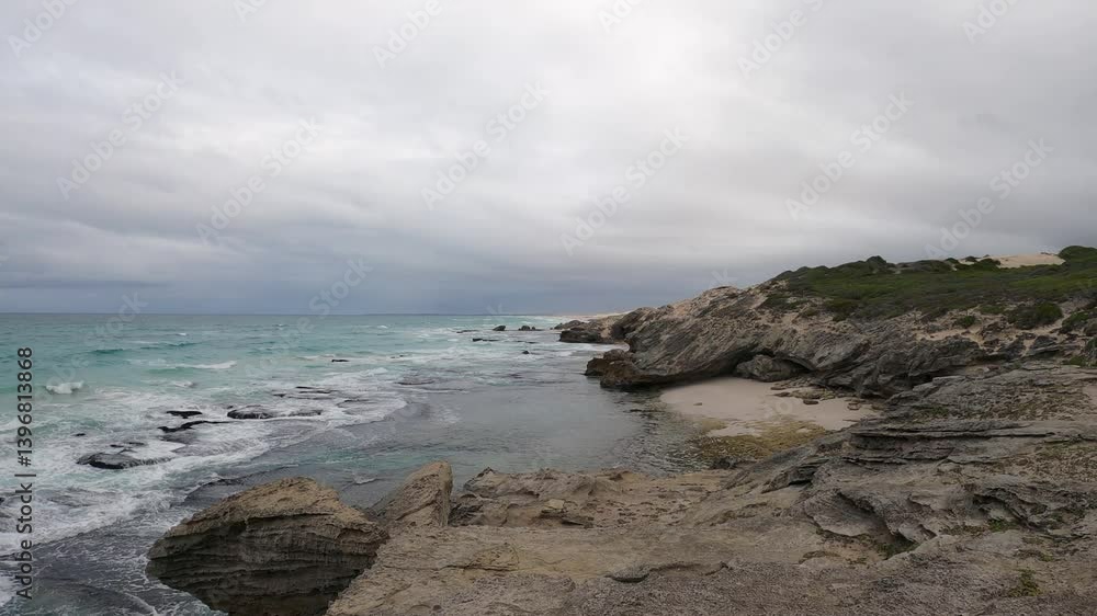 Heavy grey overcast cloud above sand and limestone beach, copy space Heavy grey overcast cloud above sand and limestone beach, copy space