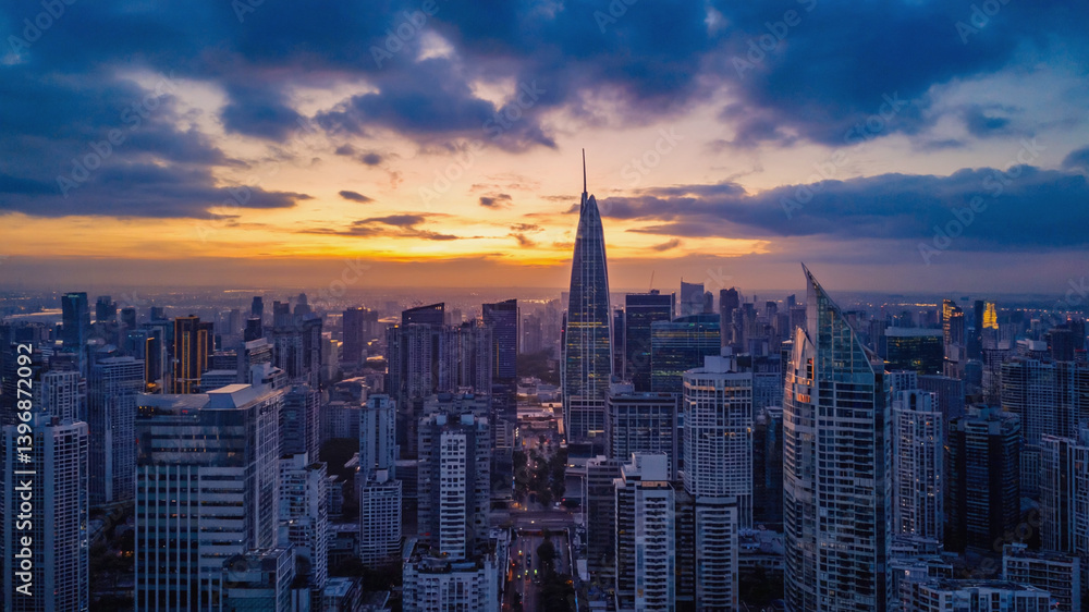 Fototapeta premium Panoramic vista of Bangkok's skyline illuminated at sunset, Thailand