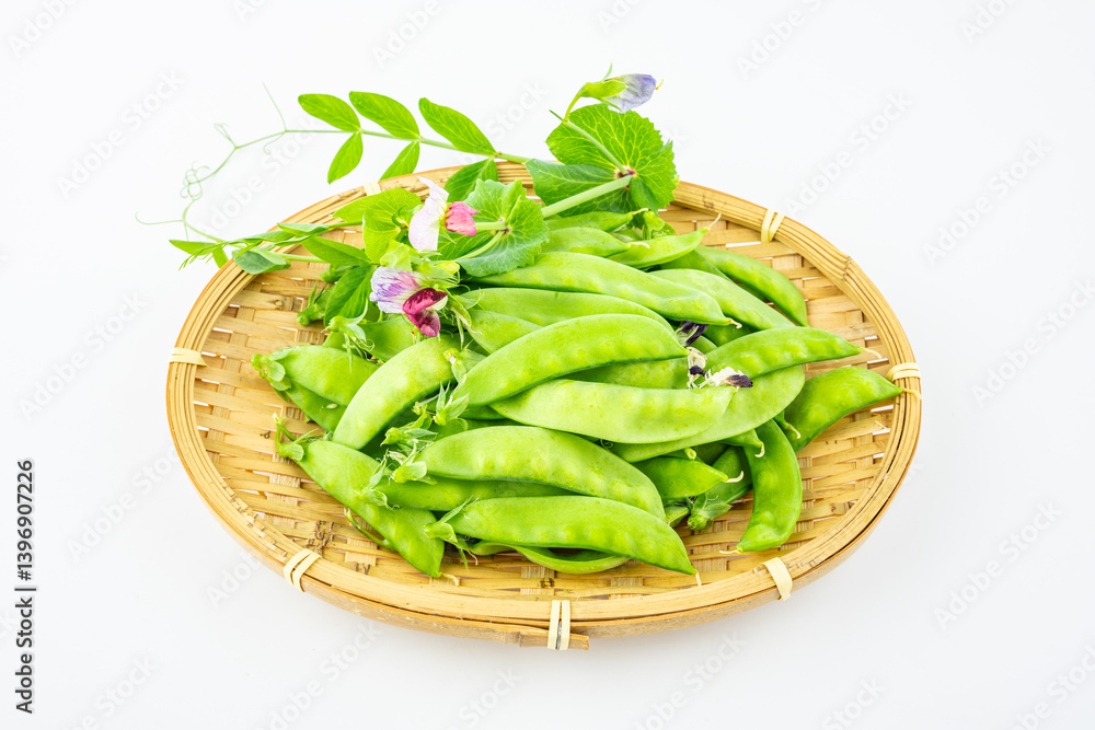 A plate of fresh peas on white background