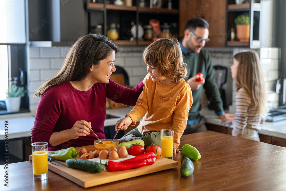 Happy family is cooking together in a bright kitchen, showing joy, teamwork, and love at home