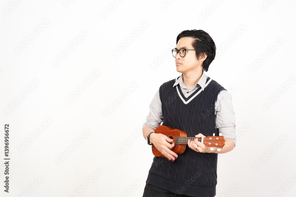 Holding and playing ukulele Of Handsome Asian Man Isolated On White Background Holding and playing ukulele Of Handsome Asian Man Isolated On White Background
