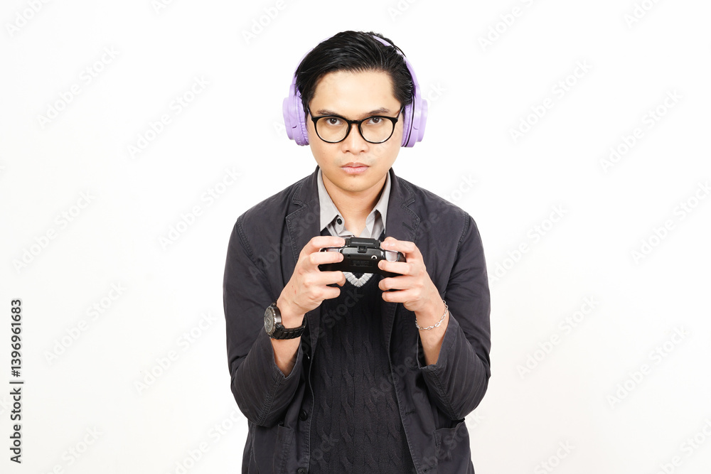 Wearing headphone and holding gamepad playing game while angry gesture Of Handsome Asian Man Isolated On White Background Wearing headphone and holding gamepad playing game while angry gesture Of Handsome Asian Man Isolated On White Background