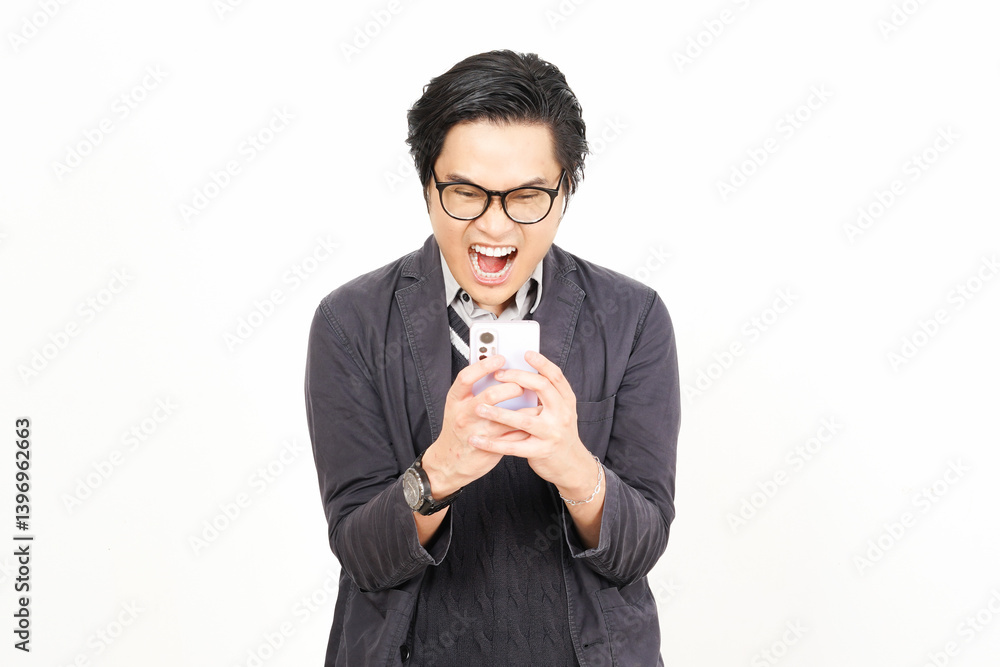 Holding smartphone and yelling make angry gesture Of Handsome Asian Man Isolated On White Background Holding smartphone and yelling make angry gesture Of Handsome Asian Man Isolated On White Background