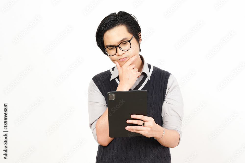 Holding and Using Tablet Of Handsome Asian Man Wearing Black Suit Isolated On White Background Holding and Using Tablet Of Handsome Asian Man Wearing Black Suit Isolated On White Background