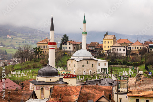 Wallpaper Mural Close-up of a small waterfall under the old stone bridge in Travnik, Bosnia and Herzegovina. Historic Ottoman architecture and natural spring surroundings. Photographed on March 25, 2025. Torontodigital.ca