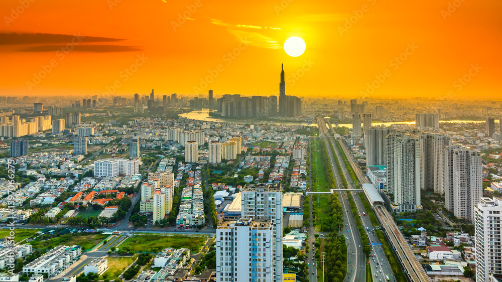 Aerial view of Saigon cityscape with a complex highway intersection. Urban development texture, transport infrastructure, Financial and business centers