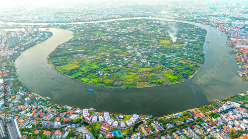 Obraz na płótnie Top view aerial of a Ho Chi Minh City with development buildings, transportation, energy power infrastructure on a winter day. Cityscape on Saigon river in Ho Chi Minh City, Vietnam w salonie