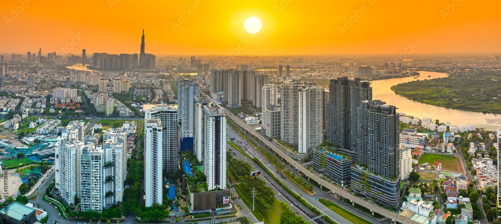 Aerial view of Saigon cityscape with a complex highway intersection. Urban development texture, transport infrastructure, Financial and business centers