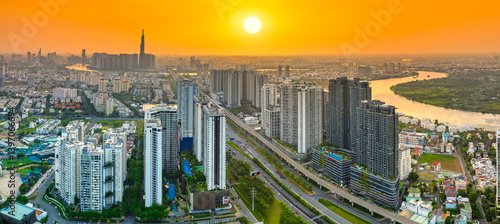 Obraz na płótnie Aerial view of Saigon cityscape with a complex highway intersection. Urban development texture, transport infrastructure, Financial and business centers w salonie