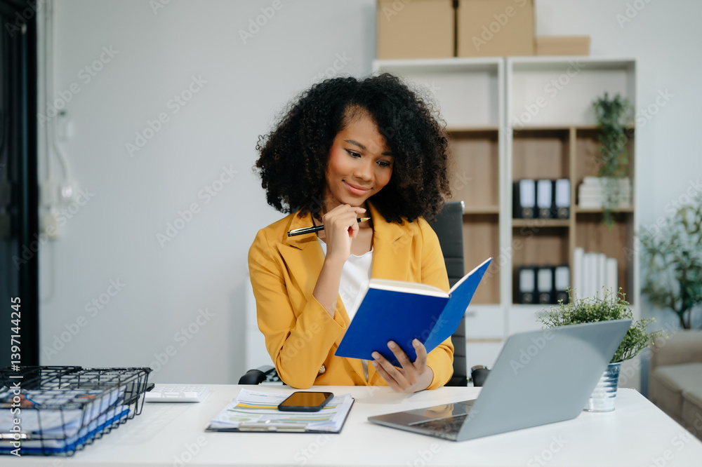Confident woman with a smile standing holding notepad and tablet Confident woman with a smile standing holding notepad and tablet