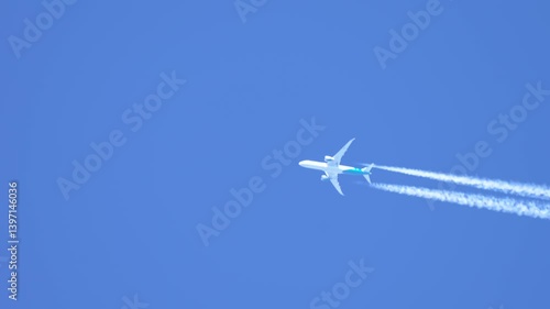 Flying jet plane leaving vapor trails in clear blue sky. Soaring aircraft producing contrails during high altitude flight. Cruising airliner generating condensation trails across bright sky