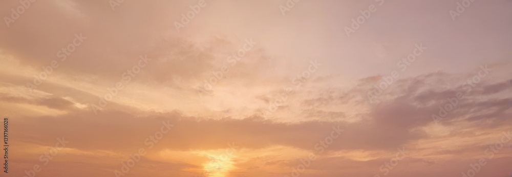 Fototapeta premium Sunset with soft clouds and warm light in the sky.