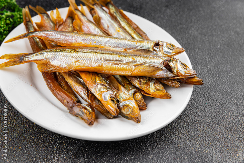 Smoked fish capelin sprat fresh dish gourmet food background on table rustic food top view copy space Smoked fish capelin sprat fresh dish gourmet food background on table rustic food top view copy space
