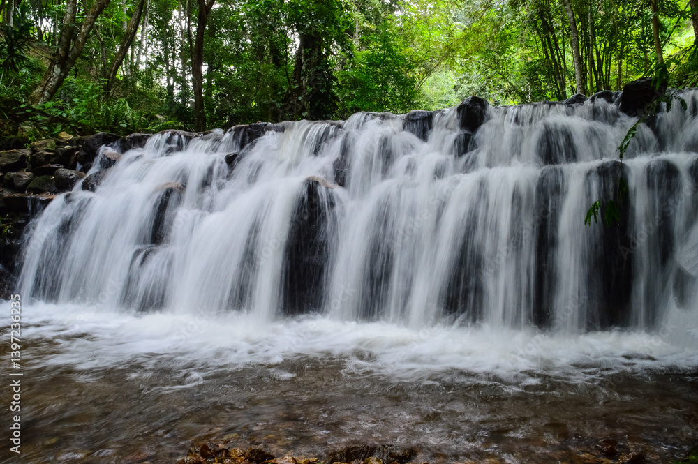 Fototapeta premium Beautiful Small Waterfall in Green Forest in jungle